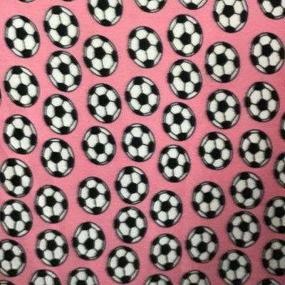 Soccer Balls on Pink Fleece Fabric