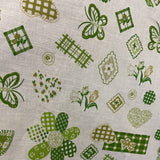 Patches on Green Poly Cotton Fabric